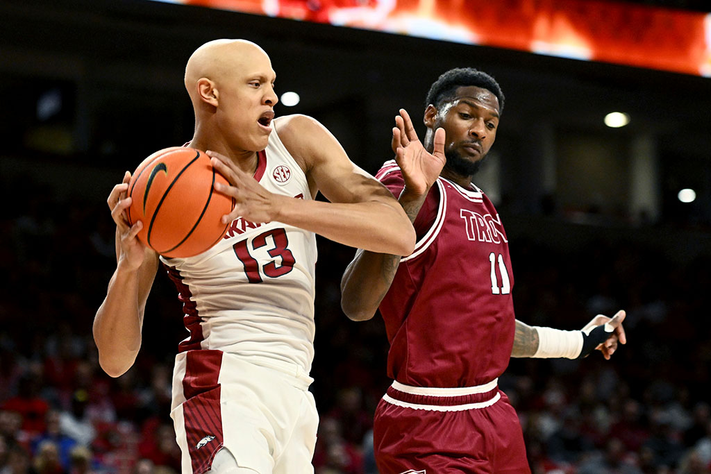 Hogs fight through jet lag to K.O. Troy late