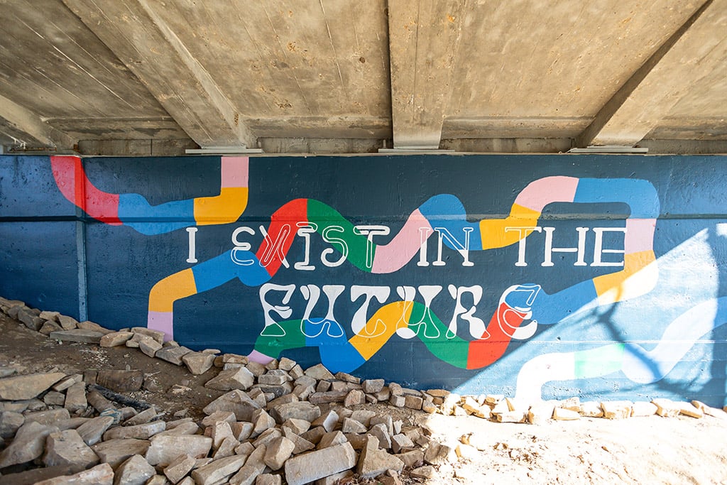 Students paint new trailside mural under Lafayette Street bridge